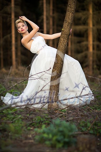 Lovely bride outdoors in a forest Lovely bride outdoors in a forest