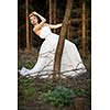 Lovely bride outdoors in a forest