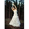 Lovely bride outdoors in a forest