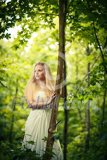 Lovely bride outdoors in a forest Lovely bride outdoors in a forest