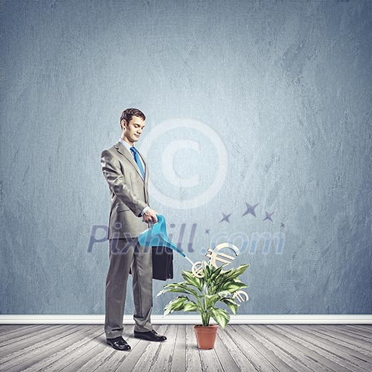 Image of young businessman watering money tree with euro symbols