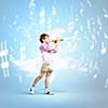 Image of little cute boy playing on flute against cloudy background