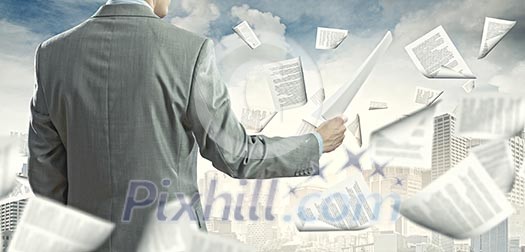 Businessman examining document in hands. Signing contract Businessman examining document in hands. Signing contract