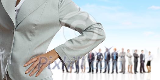 Businesswoman with business work group at background