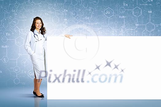 Image of young female doctor with blank banner. Place for text Image of young female doctor with blank banner. Place for text