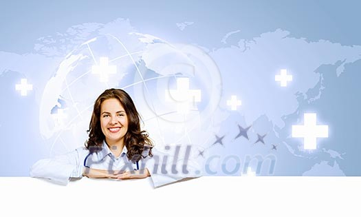 Image of young female doctor with blank banner. Place for text Image of young female doctor with blank banner. Place for text