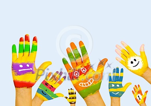 Image of human hands in colorful paint with smiles Image of human hands in colorful paint with smiles