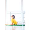 Pretty young woman doing YOGA exercise at home