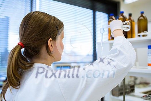 Portrait of a female researcher carrying out research in a chemistry lab (color toned image; shallow DOF) Portrait of a female researcher carrying out research in a chemistry lab (color toned image; shallow DOF)