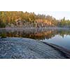 Rock surface by early morning lake view