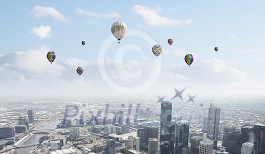 Conceptual image with colorful balloons flying high in sky Conceptual image with colorful balloons flying high in sky