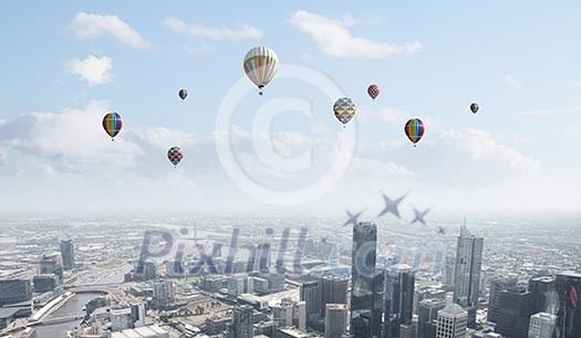 Conceptual image with colorful balloons flying high in sky