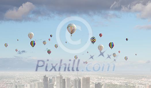 Conceptual image with colorful balloons flying high in sky