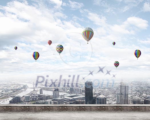 Conceptual image with colorful balloons flying high in sky