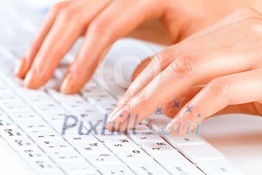 Close up of female hands typing on keyboard