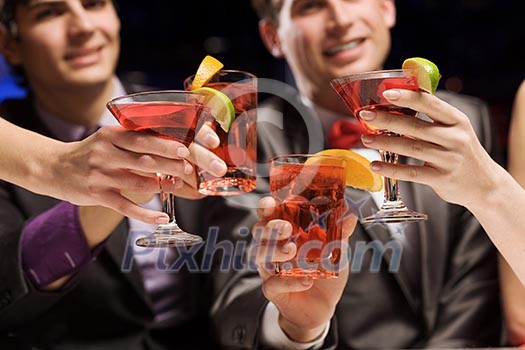 Young attractive people of four having cocktail party Young attractive people of four having cocktail party