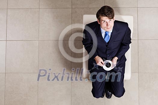 Top view of businessman sitting on chair Top view of businessman sitting on chair