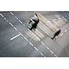 City business people crossing a street - motion blurred abstract background