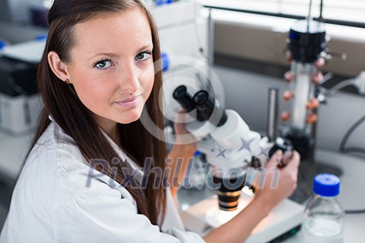 Portrait of a female chemistry student carrying out research in a chemistry lab (color toned image; shallow DOF)