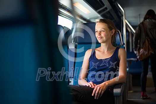 Young woman traveling by train Young woman traveling by train