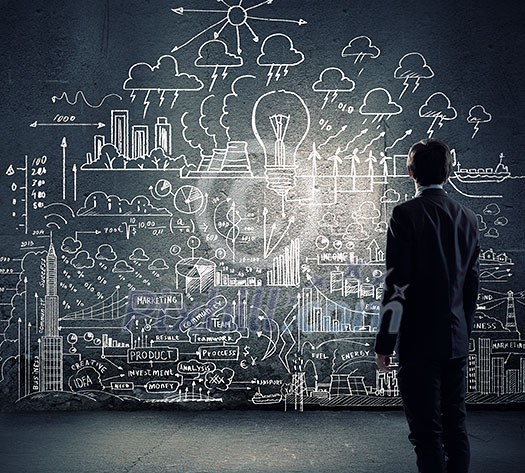 Rear view of businessman looking at chalk sketches on wall