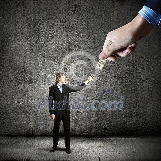 Close up of hand giving money to businessman