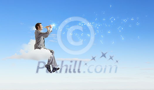 Young carefree businessman sitting on cloud and playing flute Young carefree businessman sitting on cloud and playing flute