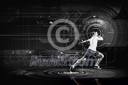 Young running man against digital media background Young running man against digital media background