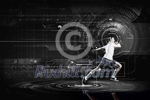 Young running man against digital media background