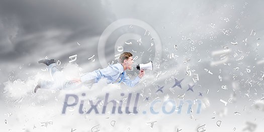 Young businessman with megaphone flying high in sky