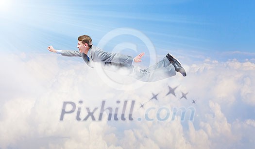 Young super businessman flying high in sky Young super businessman flying high in sky