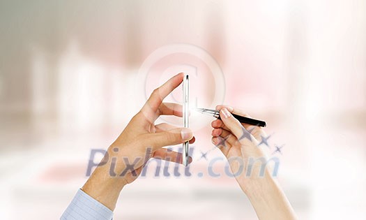 Close up of people hands using mobile phone