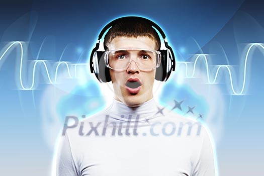 Young man wearing headphones against media background. New technologies
