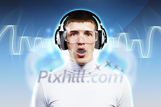 Young man wearing headphones against media background. New technologies Young man wearing headphones against media background. New technologies