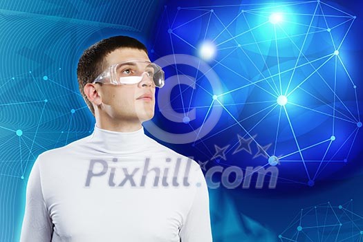 Young man in white against blue background with hologram around head Young man in white against blue background with hologram around head