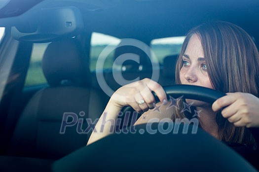 Cute teenager driving her brand new car Cute teenager driving her brand new car