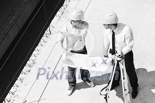 Team of architects people in group  on construciton site check documents and business workflow