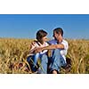 happy young couple in love have romance and fun at wheat field in summer