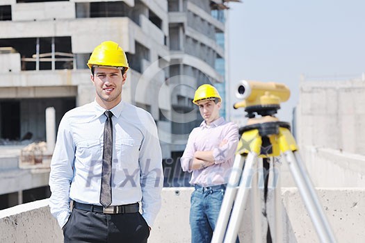 Team of business people in group, architect and engeneer on construciton site check documents and business workflow on new building Team of business people in group, architect and engeneer on construciton site check documents and business workflow on new building