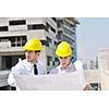 Team of architects people in group  on construciton site check documents and business workflow