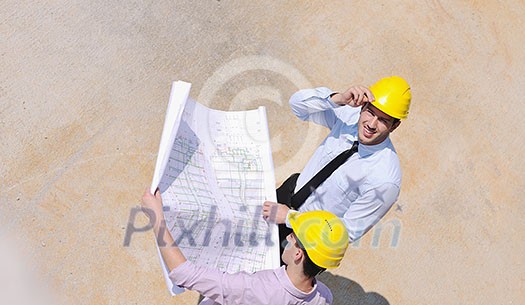 Team of architects people in group on construciton site check documents and business workflow Team of architects people in group on construciton site check documents and business workflow