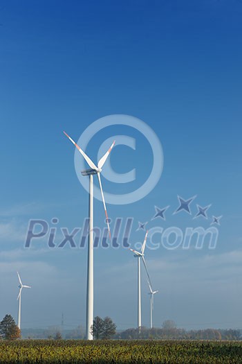 wind turbine generating eco friendly renewable electricity energy on blue sky wind turbine generating eco friendly renewable electricity energy on blue sky