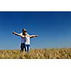 happy young couple in love have romance and fun at wheat field in summer