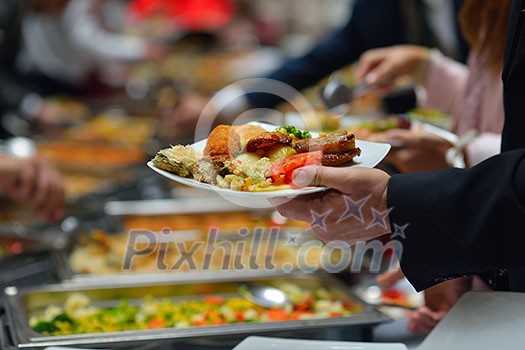 people group catering buffet food indoor in luxury restaurant with meat colorful fruits  and vegetables