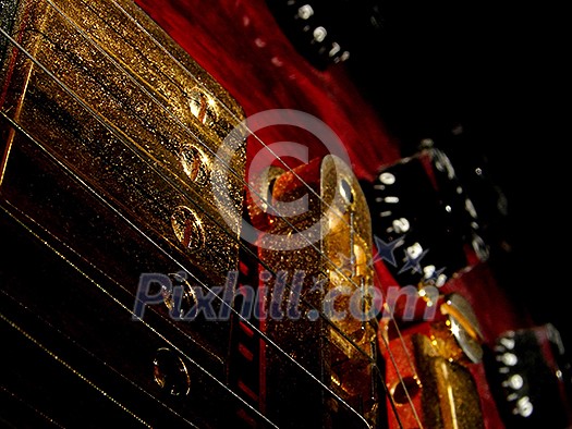music concept with red electric guitar isolated on black background in dark