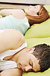 happy young couple in bed at morning