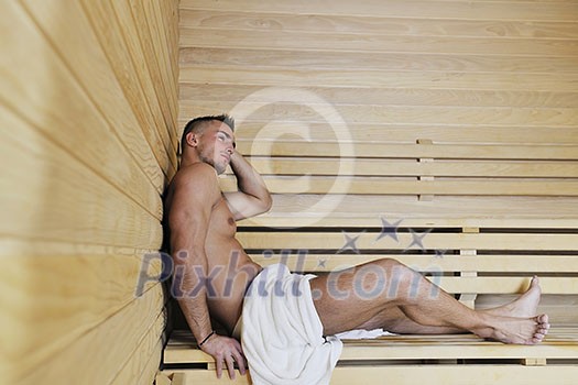 happy good looking and attractive young man with muscular body  relaxing in sauna hot
