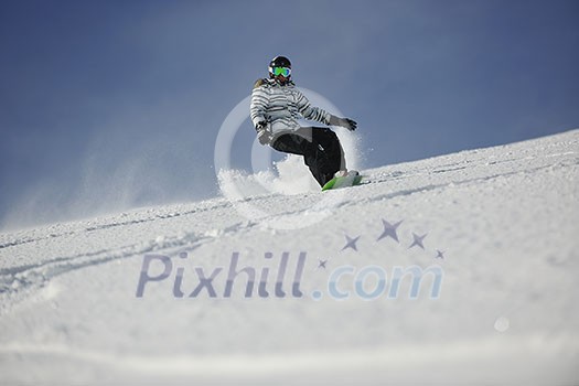 snowboard woman racing downhill slope and freeride on powder snow at winter season and sunny day