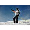 young man pointing direction on winter season during recration ski on mountain with show