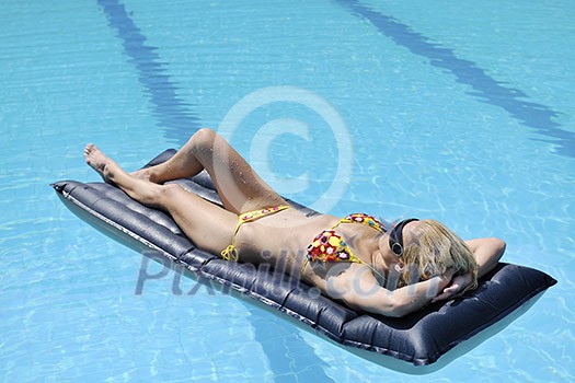 beautiful young woman relax and have fun at swimming pool beautiful young woman relax and have fun at swimming pool